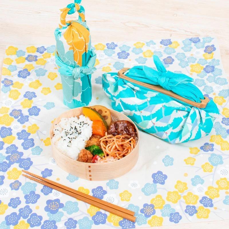 Hime Musubi Flower Furoshiki in blue, used as lunchbox wrap